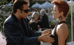 Lauren Holly and Andrew Dice Clay in The Adventures of Ford Fairlane (1990)