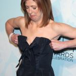 Dana Delany trying to fit in her dress